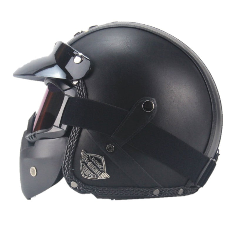 Vintage motorcykelhjälm i konstläder med visir och glasögonmask