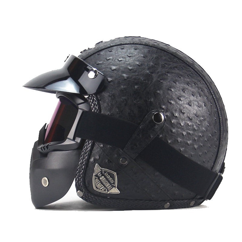 Vintage motorcykelhjälm i konstläder med visir och glasögonmask