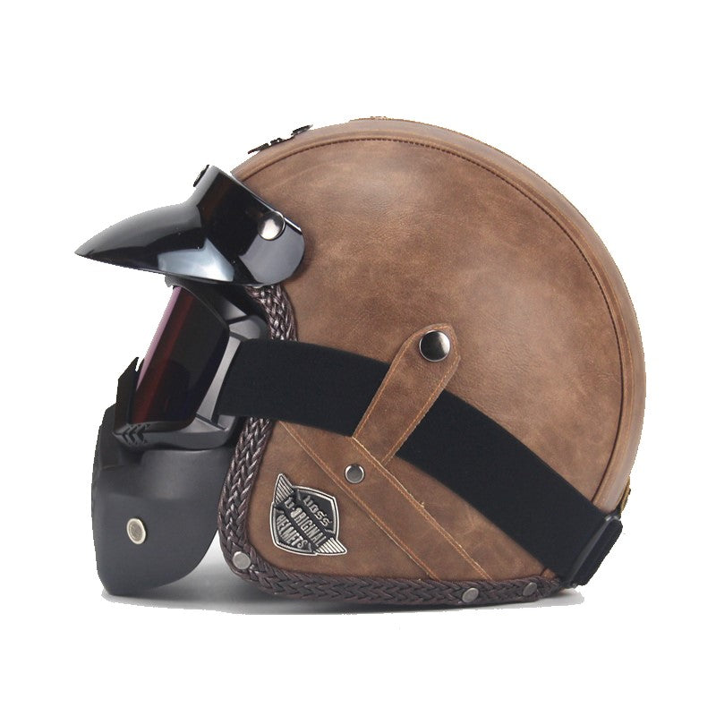 Vintage motorcykelhjälm i konstläder med visir och glasögonmask
