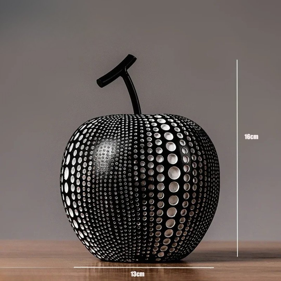 Elegant äppelskulptur med svartvita prickar – nordisk design
