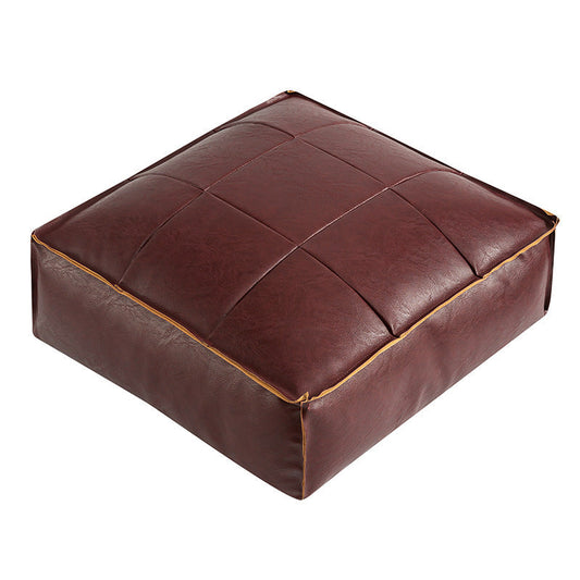 Elegant sittpuff i konstläder med nätmönster – Stilfull komfort