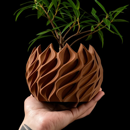 Geometrisk blomkruka i bioplast med unik vågdesign