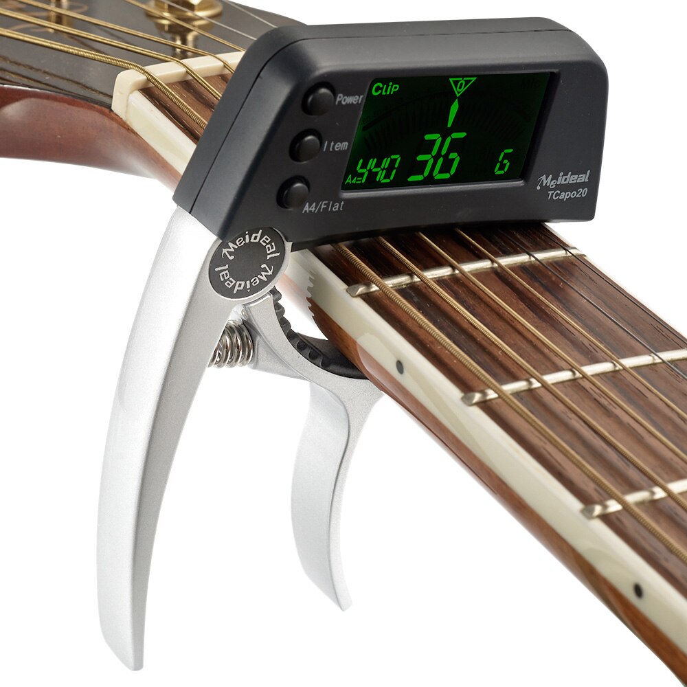 Praktisk 2-i-1 Gitarr-capo med Inbyggd Stämapparat