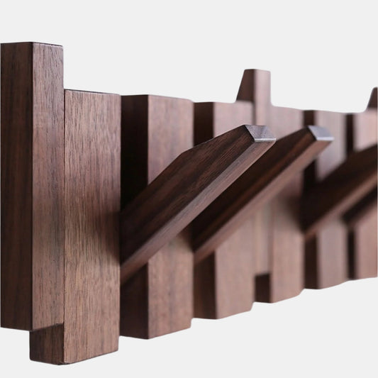 Vikbart väggställ i trä med unik piano-inspirerad design