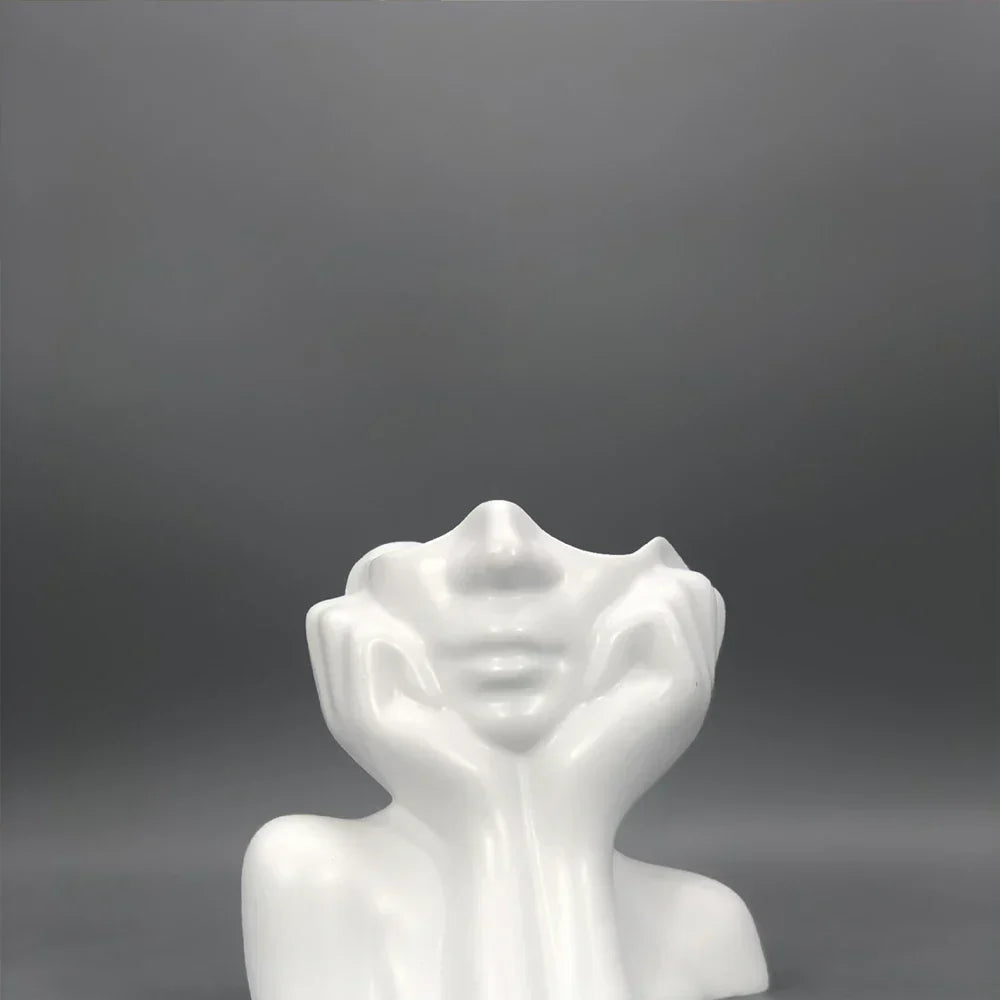 Glad blomkrukkeskulptur
