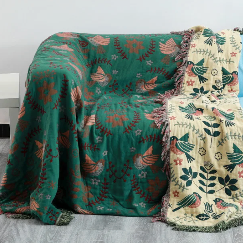 Vändbar pläd med fågelmotiv – Skandinavisk mys till hemmet