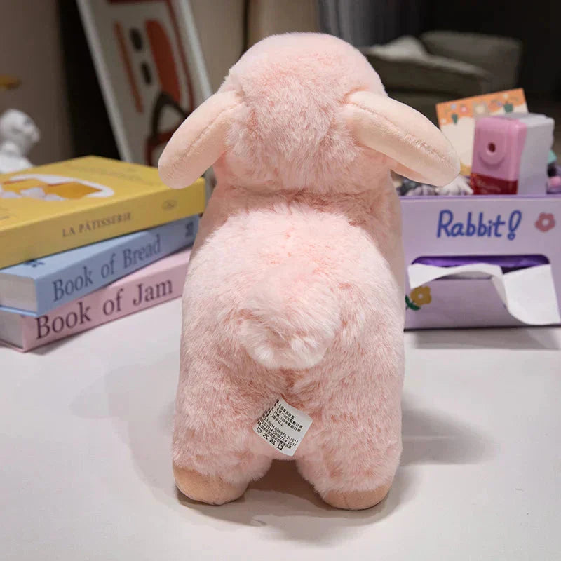 Fluffigt rosa-vitt får mjukisdjur