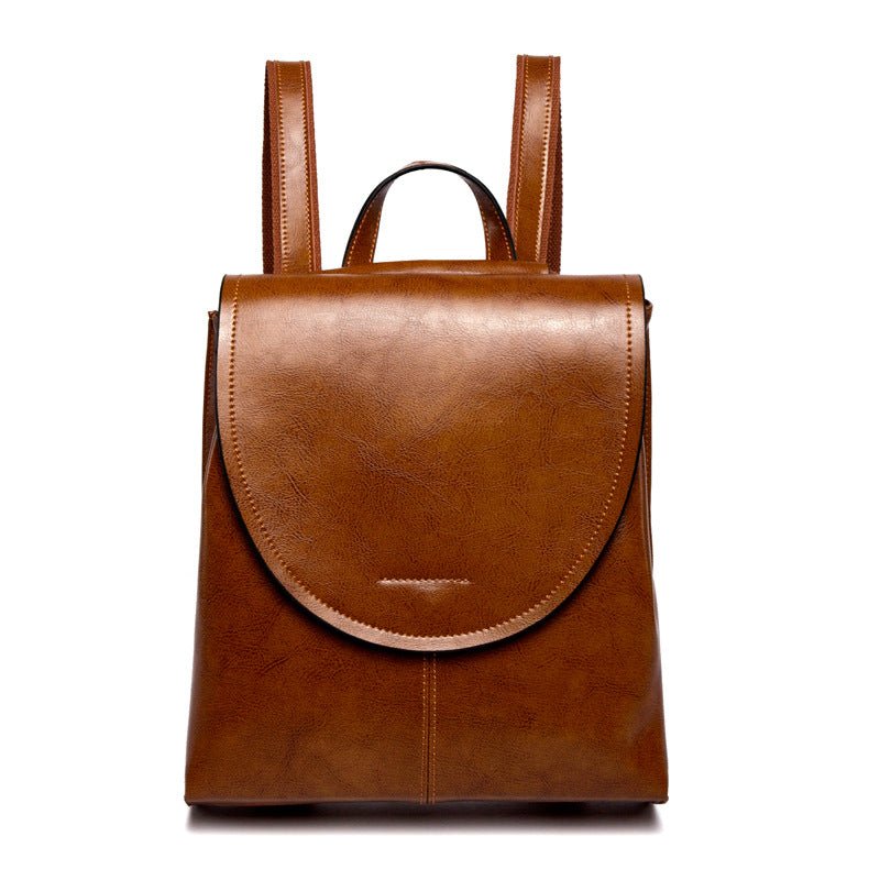 Elegant damryggsäck i läder med justerbara remmar och rymlig design