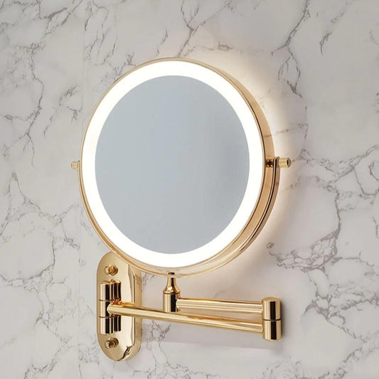 Elegant LED-väggspegel med förstoring och guldfinish